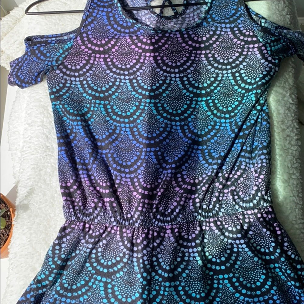 Girls romper with mermaid inspired pattern.